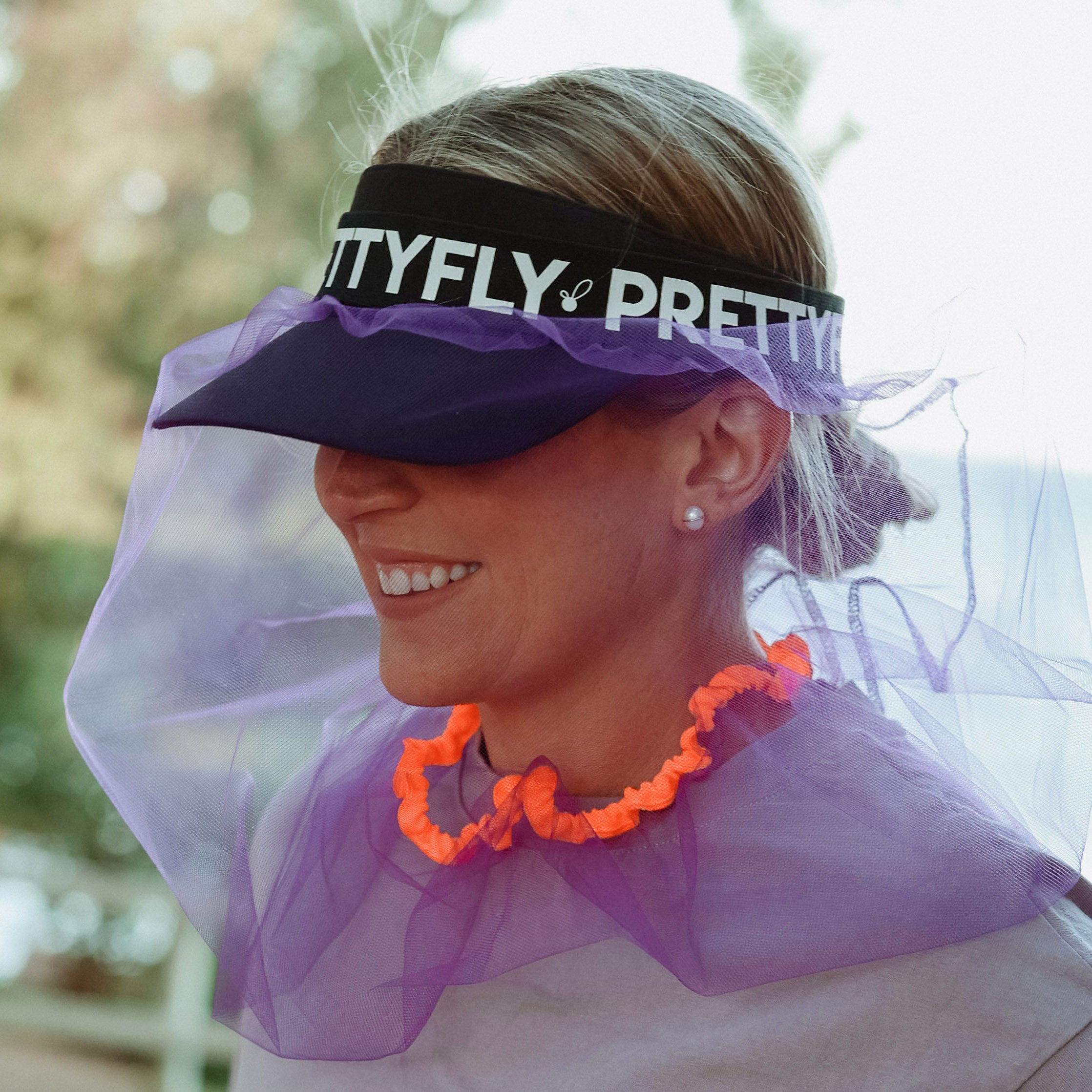 Colourful purple fitness fly net over running hat